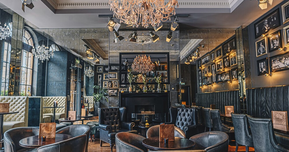 Angels Share Hotel, Edinburgh - luxurious bar / lounge with commercial art frames on the wall
